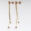 Pozłacane długie srebrne kolczyki kuleczkami